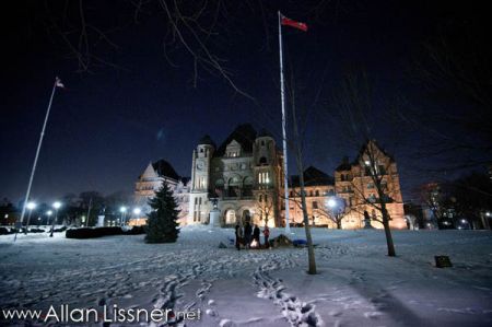 Allan Lissner braved the bitter cold to photograph Algonquin Firekeeper Daniel Amikwabe Bernard and supporters as he kept a vigil and sacred fire outside Queen’s Park to in response to logging in the South March Highlands of Ottawa.