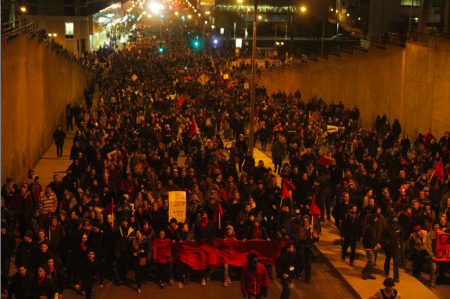 Photo from the Montreal Media Co-op showing protesters going through the underpass near the start of the march