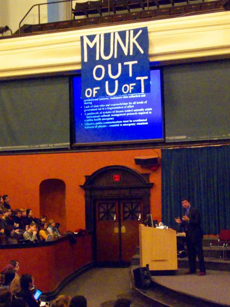 U of T President David Naylor looked surprised but tried to ignore the banner. He was instrumental in the undemocratic approval of the Munk contract.