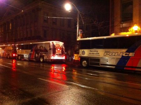 Riot buses pull up to Occupy Toronto (photo: Rebecca GL)