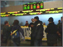 Protesters inside Exchange Tower, chant bellow stock ticker.  Cell phone photo by Tim Groves
