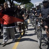 Police flank marchers - Photo: Activestills