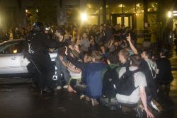 Protesters trapped in front of Novatel by police. Photo: Activestills
