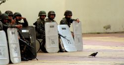 Nov. 27, 2009 - Soldiers wait behind the police line, in case the decision to supress the demonstrations is taken again.