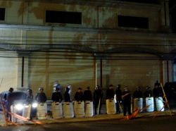 Nov. 30, 2009 - With more people on the scene demanding President Zelaya's release, the police respond by adding to their numbers - by this point, there are police lines on three sides of the demonstration, with the Burger King on the other.