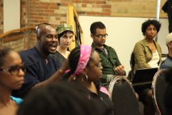 Member of the audience posing a question at Emancipation Day 2012 event