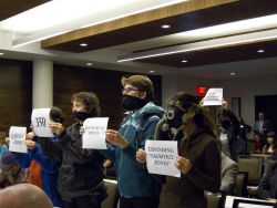 Silent Protest inside the hearing to bring attention to what discussion is being banned from the NEB hearings. Photo Credit: Michael Toledano