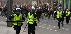 This photo of police running from protesters was widely shared on facebook. 