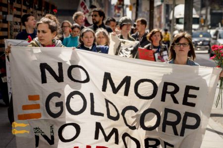 The crowd marched through Toronto’s Financial District to greet Goldcorp head executives and shareholders outside of Goldcorp Inc’s Shareholders Meeting held at the Sheraton Hotel.