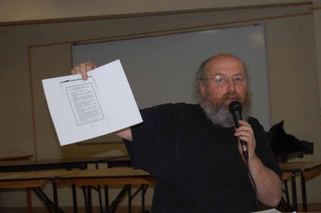 Gaetan Heroux holds up a copy of the program of the unemployed council movement of 1933 as he addresses a meeting of poor people on Friday, March 26. PHOTO: Mick Sweetman