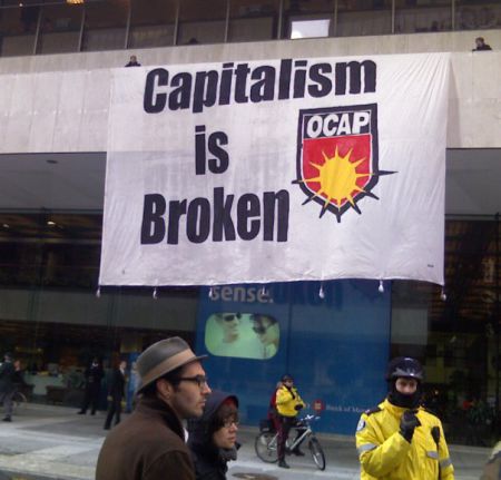 Banner dropped from Bank of Montreal during march on the financial district.  Photo: David Sone
