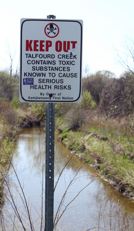 one of several warning sign by area waterways
