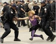 I was violently arrested, then assaulted once I was thrown in an unmarked van with four thugs (who may have been plain-clothes officers). Photo appeared in New York Times, 06/27/2010.