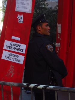 Cop standing guard at occupywallstreet