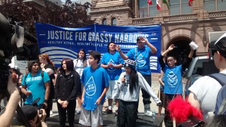 Grassy Narrows Youth performing song "Home to Me." Queen's Park, Toronto, Ontario. Madalene Arias for Toronto Media Co-op.