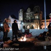 Daniel Amikwabe Bernard (right) and supporters brave the sub-zero temperatures to tend to the Sacred Fire at Queens Park
