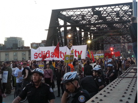 marchers on the bridge towards Porter airline (Photo: q_e_d)