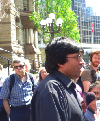 Jaggi Singh address the media outside Old City Hall. (photo: q_e_d))