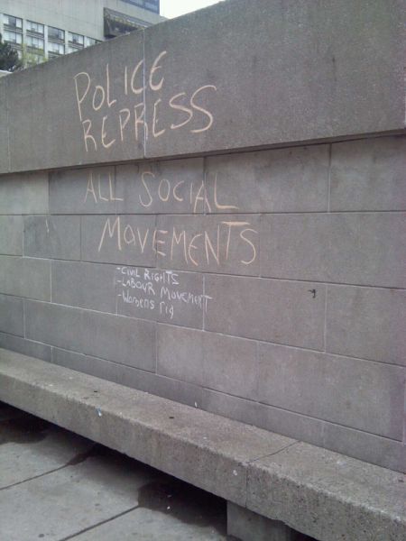 In Nathan Phillips Square.  The man who wrote this was threatened with a mischief charge.  Photo by Megan Kinch.